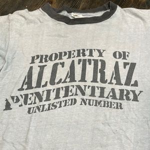 Vintage ‘Property of Alcatraz’ ringer T. Women’s small vintage fit. Gray/ blk